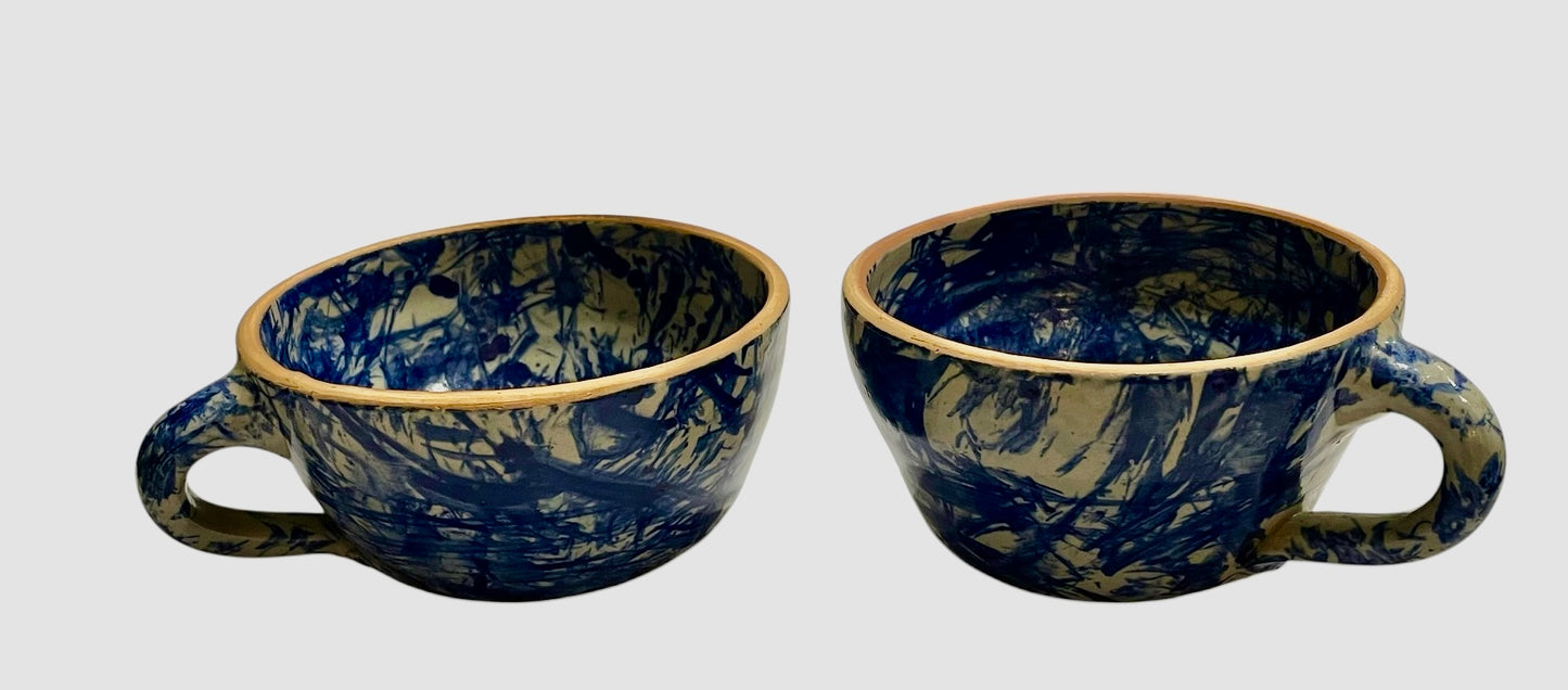 Pair of large pottery mugs w/ spatter glaze