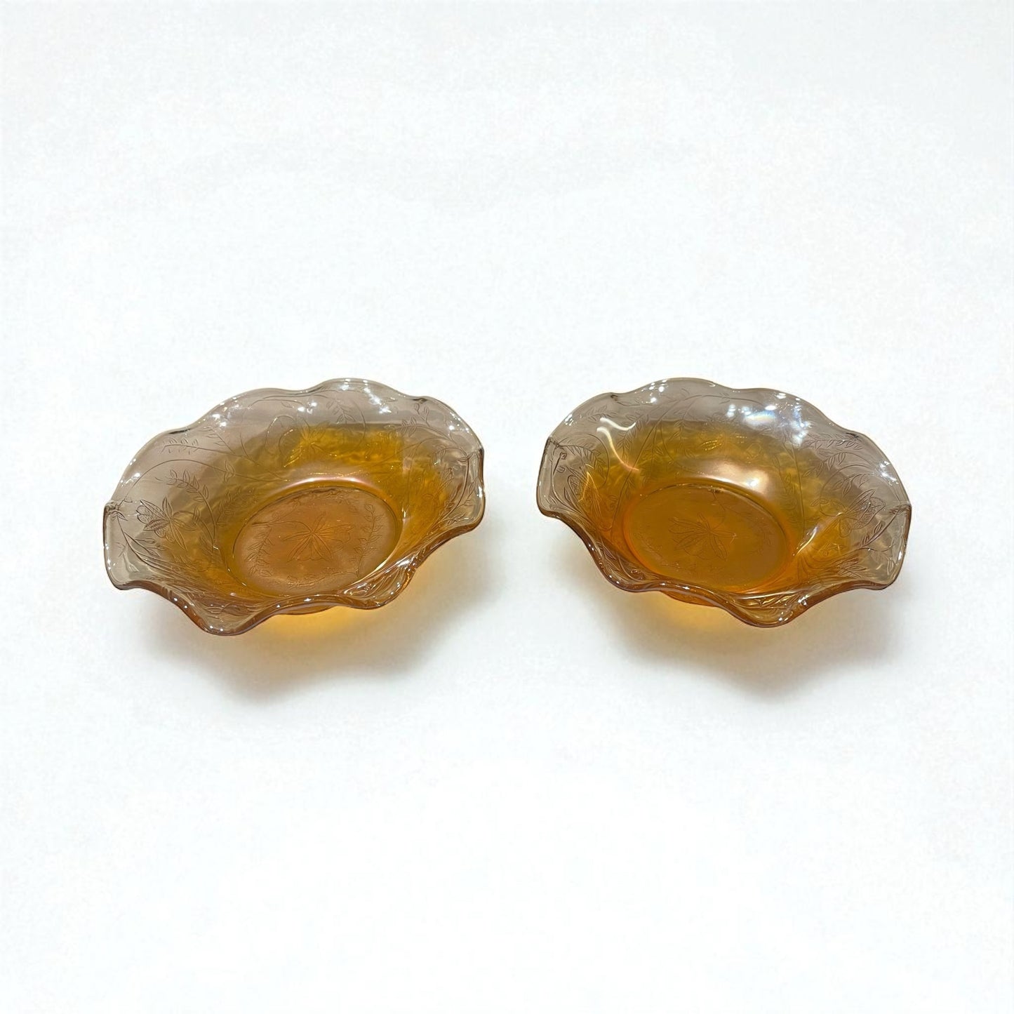 Pair of Jeannette carnival glass bowls