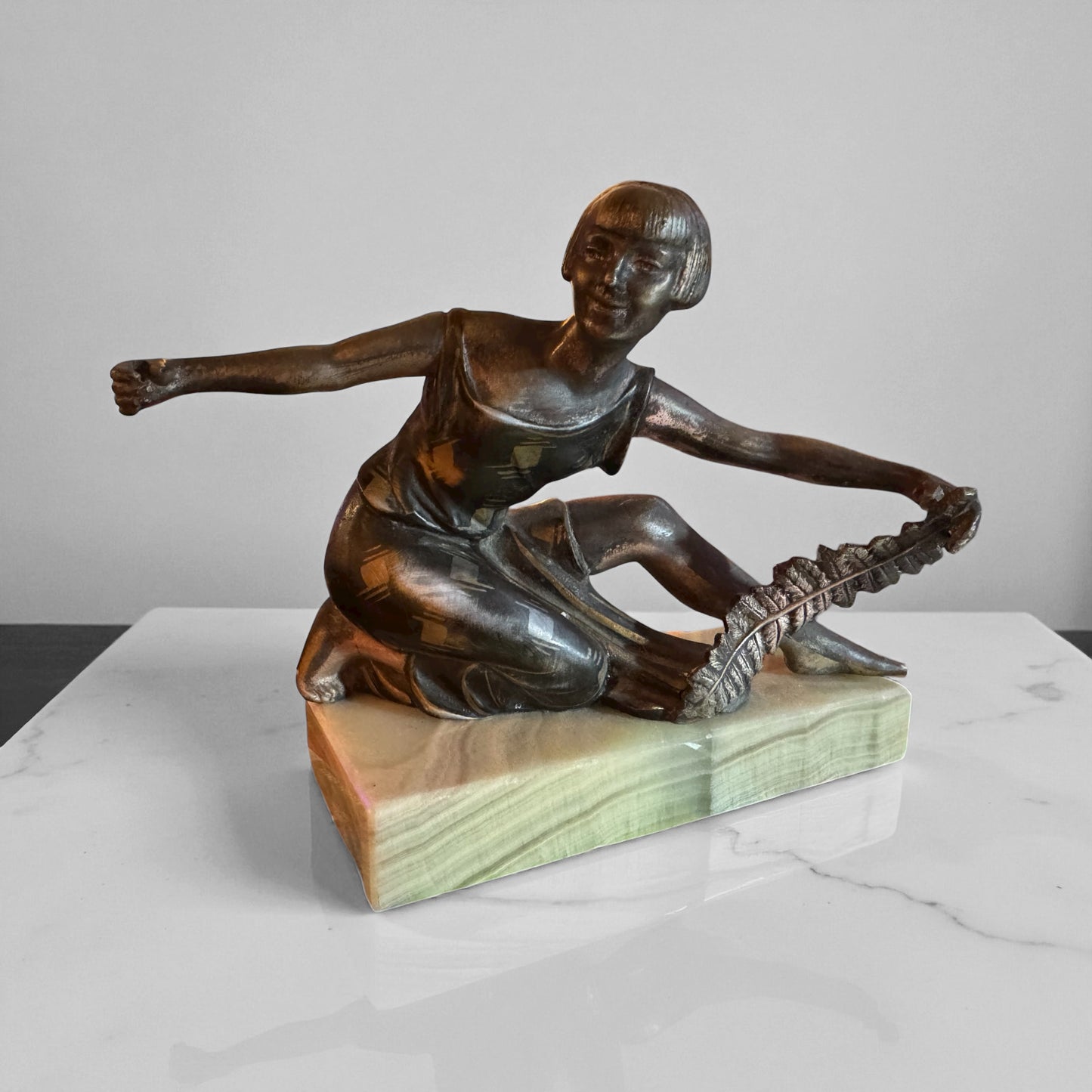 Antique Metal Sculpture of Female with Feather by P. Sega