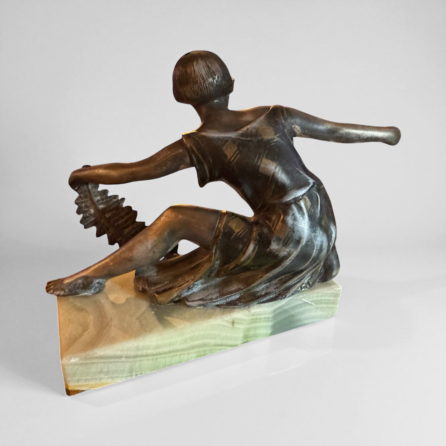Antique Metal Sculpture of Female with Feather by P. Sega